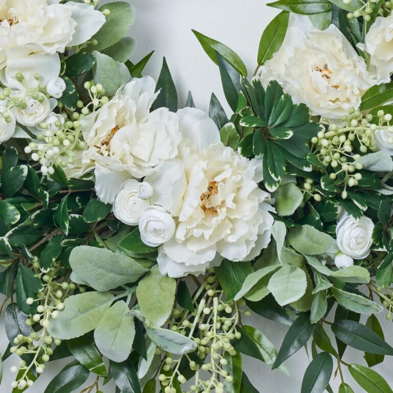 Close-up of blooms and berries on this White Peony, Ranunculus, Lamb's Ear, Front Door Wreath