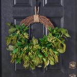 Alternate angle of the Lush Life - Mixed Greenery Seasons Half Wreath showing wreath face