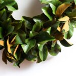 Detail view of layered greenery detail from the Extra Large Classic Real Touch Door Mantel
