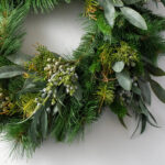 Full display view of the Seeded Eucalyptus and Christmas Pine Door Holiday Wreath with wreath