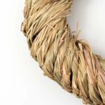 Close-up of blooms and berries on this All Season Wrapped Natural Jute Bow Option