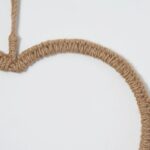 Close-up of blooms and berries on this All Season Braided Natural Jute Hanging Wall Ornament