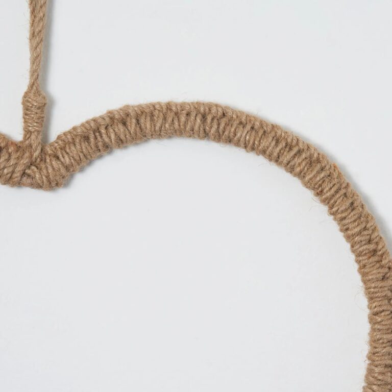 Close-up of blooms and berries on this All Season Braided Natural Jute Hanging Wall Ornament