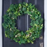Side view of the Everyday Mixed Greenery Geranium, Clover All Seasons Wreath revealing frame and