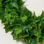 Close-up of blooms and berries on this All Seasons Green Real Touch Front Door Wreath