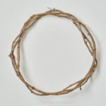 Side view of the All Seasons Natural Broad Vine Twig Everyday Wreath revealing frame and