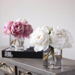 Side view of the Pink Real Touch Peony Floral Clear Glass Vase revealing bloom arrangement
