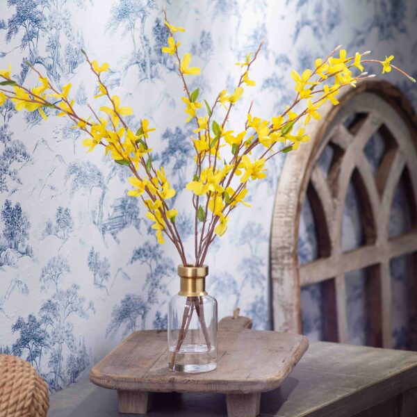 Yellow Forsythia Branch Spring Water Illusion Arrangement in Tall Gold Rim Bottle Vase