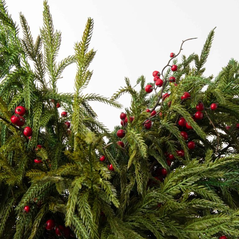 Close-up of vase silhouette detail on this Norfolk Pine and Red Berry Tall Glass Vase
