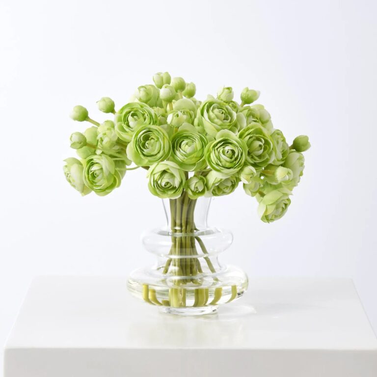 Close-up of vase silhouette detail on this Mini Ranunculus Blooms In Modern Water Illusion Arrangement
