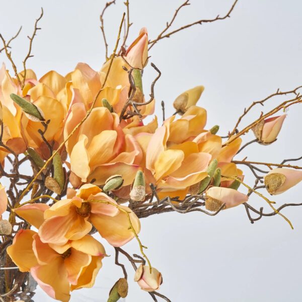 Close-up of vase silhouette detail on this Golden Hour Magnolia Blooms Water Illusion Arrangement