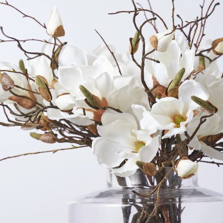 Close-up of vase silhouette detail on this Magnolia Blooms and Branches Water Illusion Arrangement