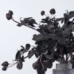 Close-up of vase silhouette detail on this Black Magic Orchid Arrangement Glass Chandelier Vase