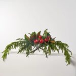 Alternate angle of the Lifelike Red Pomegranate, Real Touch Oval Vase Christmas showing bloom arrangement