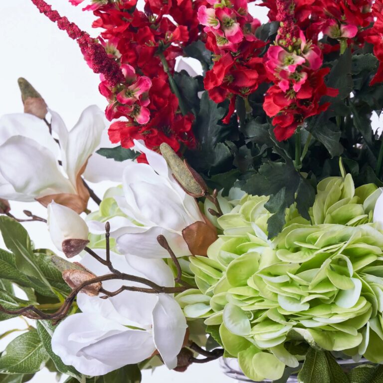 Close-up of vase silhouette detail on this Festive Holiday Blooms - Red Vase Christmas Arrangement