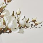 Close-up of vase silhouette detail on this White Magnolia Blooms and Branch Pyramid Style Vase