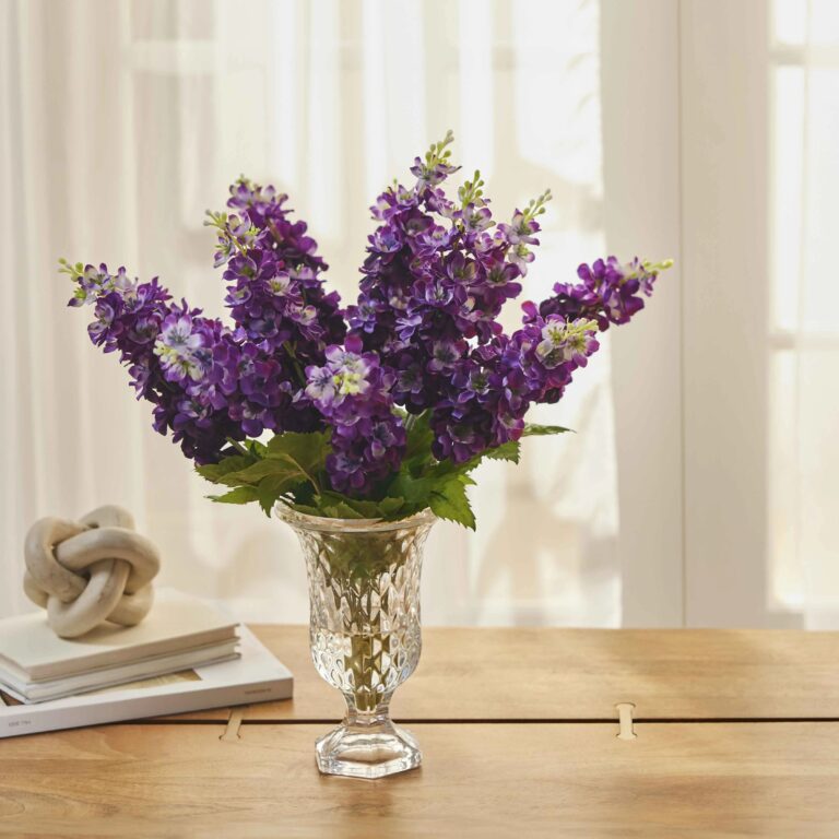 Close-up of vase silhouette detail on this Purple Lavender Delphinium Blooms Footed Urn Vase