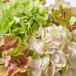 Close-up of vase silhouette detail on this Abundant Blooms - Real Touch Water Illusion Arrangement