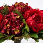 Close-up of vase silhouette detail on this Holiday Affair - Christmas Red Illusion Centerpiece Arrangement