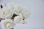 Close-up of vase silhouette detail on this White Silk Rose Bouquet Water Illusion Arrangement