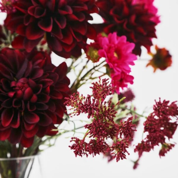 Close-up of vase silhouette detail on this Wild at Heart - Burgundy Water Illusion Arrangement