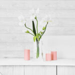 Alternate angle of the Large Lifelike White Iris Blooms Water Illusion Arrangement showing bloom arrangement