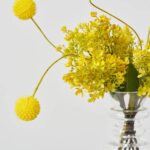 Close-up of vase silhouette detail on this Sunshine On Me - Yellow Water Illusion Arrangement