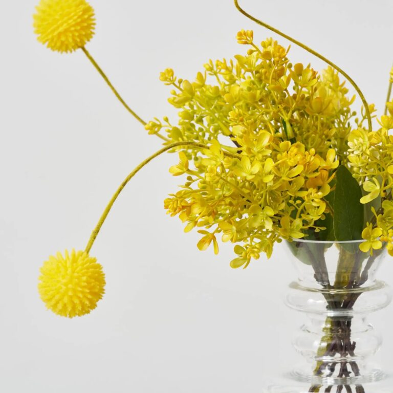 Close-up of vase silhouette detail on this Sunshine On Me - Yellow Water Illusion Arrangement