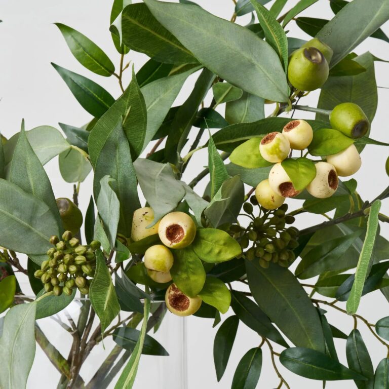 Close-up of vase silhouette detail on this Lifelike Eucalyptus Seed Pods Water Illusion Arrangement