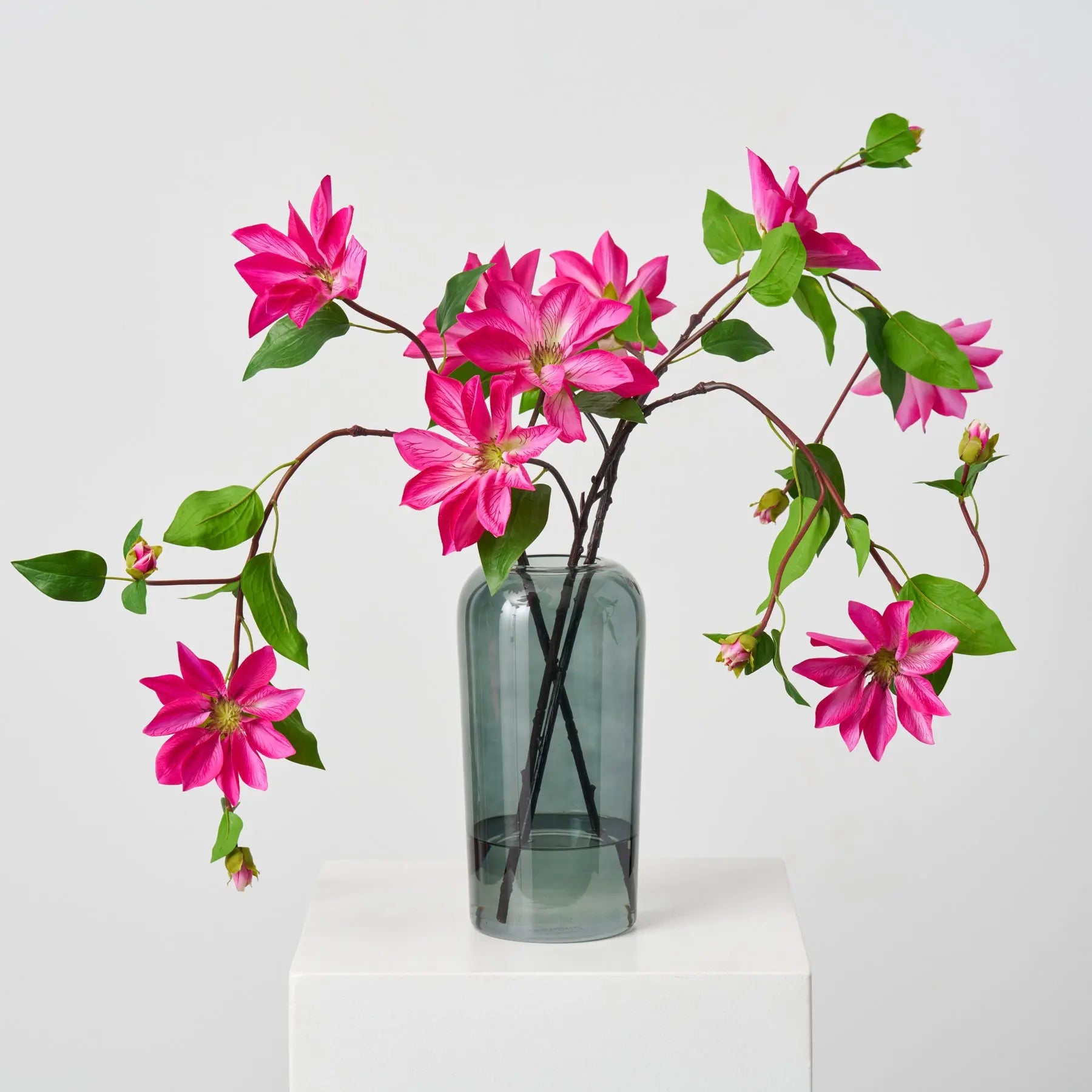 FAR1544RealTouchFuchsiaPinkClematisBloomingVinesinSmokeGlassRoundedVaseSpringCenterpieceWater_1.jpg Real Touch Fuchsia Pink Clematis Blooming Vines in Smoke Water Illusion Arrangement