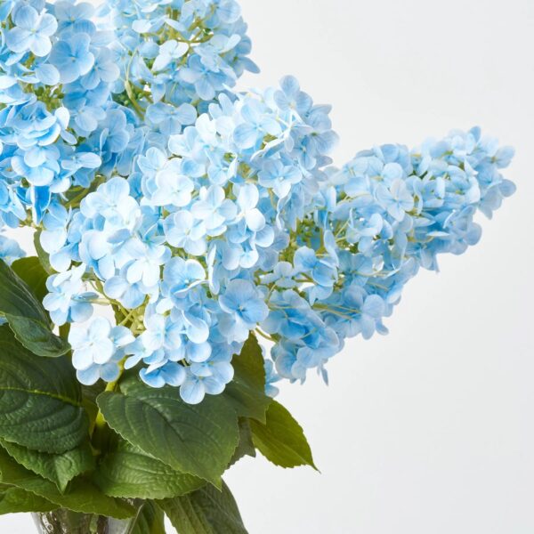 Close-up of vase silhouette detail on this Real Touch Light Blue Panicle Recycled Glass Vase