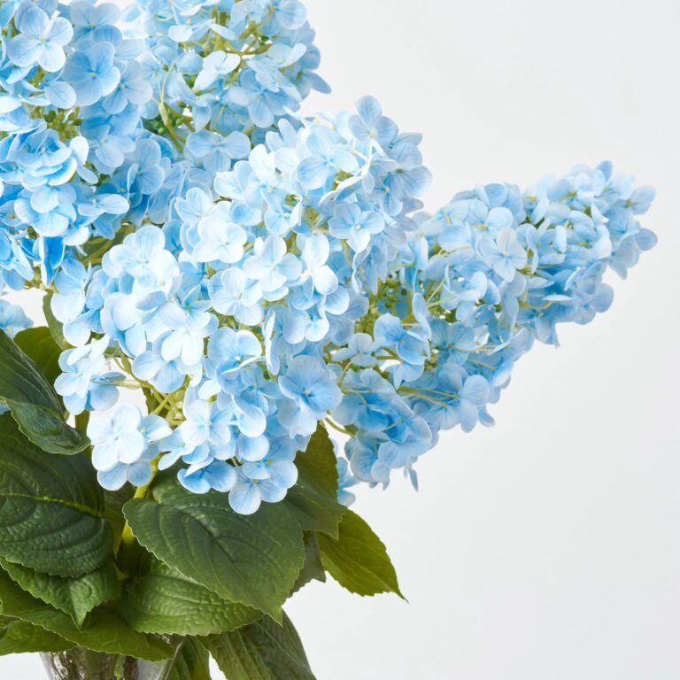 Close-up of vase silhouette detail on this Real Touch Light Blue Panicle Recycled Glass Vase