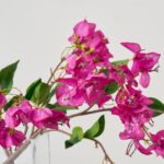 Close-up of vase silhouette detail on this Lifelike Cerise Bougainvillea Branches Illusion Centerpiece Arrangement