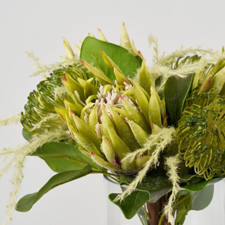Close-up of vase silhouette detail on this Protea Paradise - Lifelike Green Water Illusion Arrangement