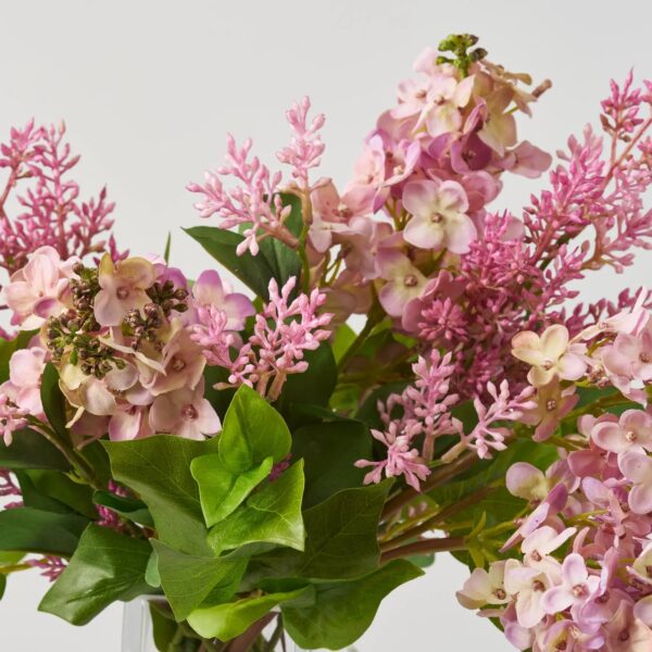 Close-up of vase silhouette detail on this Real Touch Pink Lavender Lilac Water Illusion Arrangement