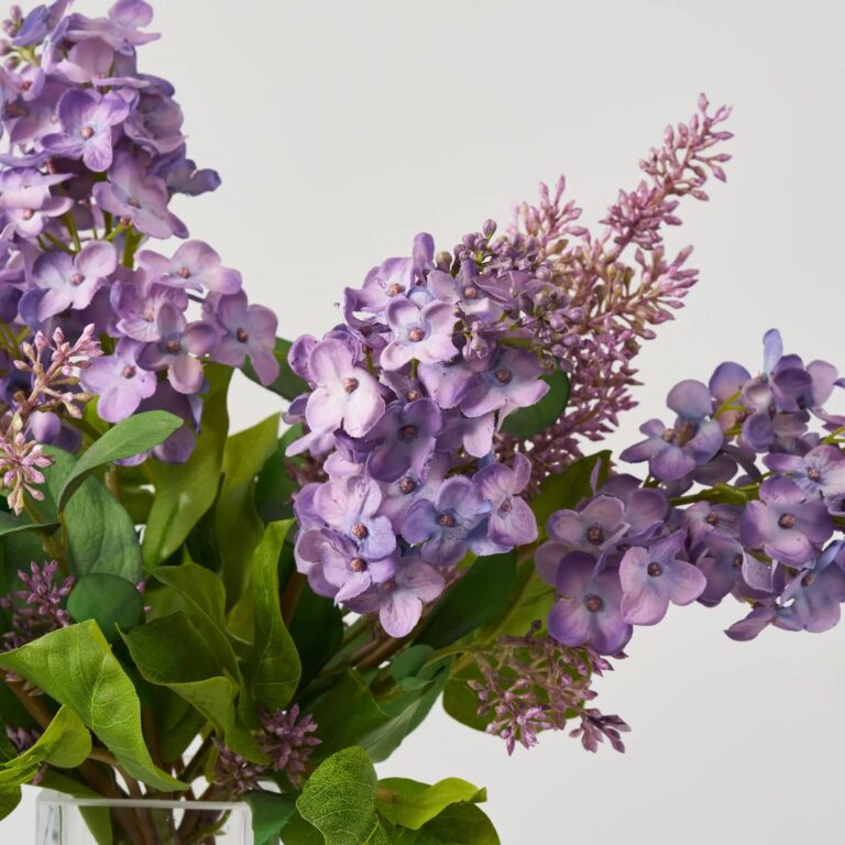 Close-up of vase silhouette detail on this Real Touch Purple Lilac Blooms Water Illusion Arrangement