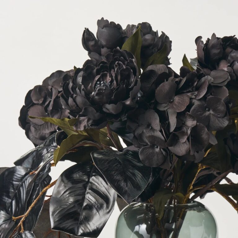 Close-up of vase silhouette detail on this Nightshade Garden - Lustrous Magnolia Illusion Centerpiece Arrangement