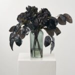 Alternate angle of the Nightshade Garden - Lustrous Magnolia Illusion Centerpiece Arrangement showing bloom arrangement