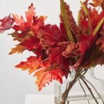 Close-up of vase silhouette detail on this Mixed Fall Brown and Burgundy Water Illusion Arrangement