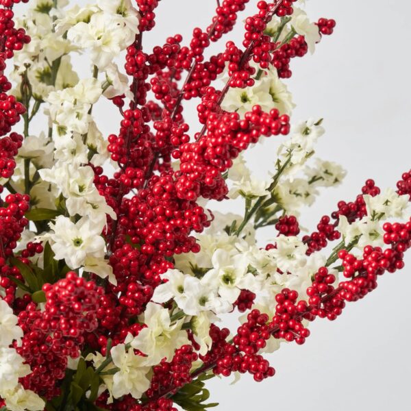 Close-up of vase silhouette detail on this Cream Larkspur Flower and Red Water Illusion Arrangement