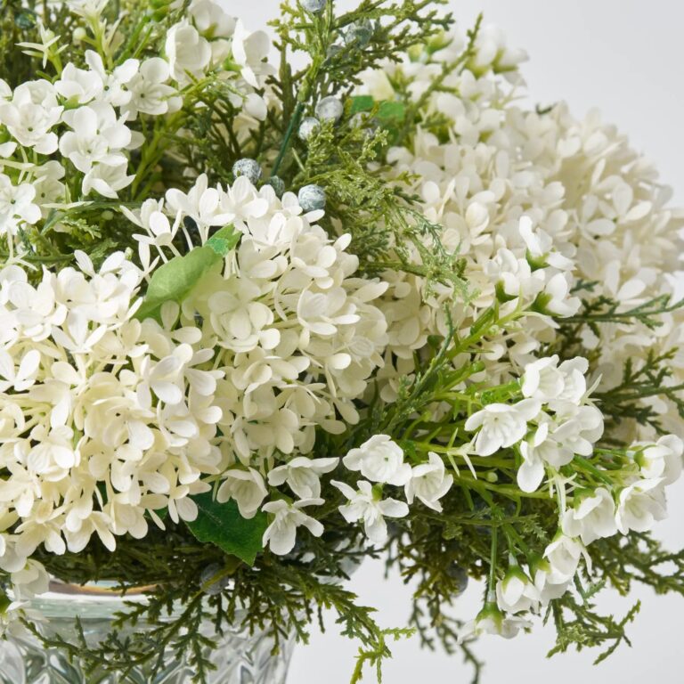 Close-up of vase silhouette detail on this Lifelike White Snowball Blooms Water Illusion Arrangement