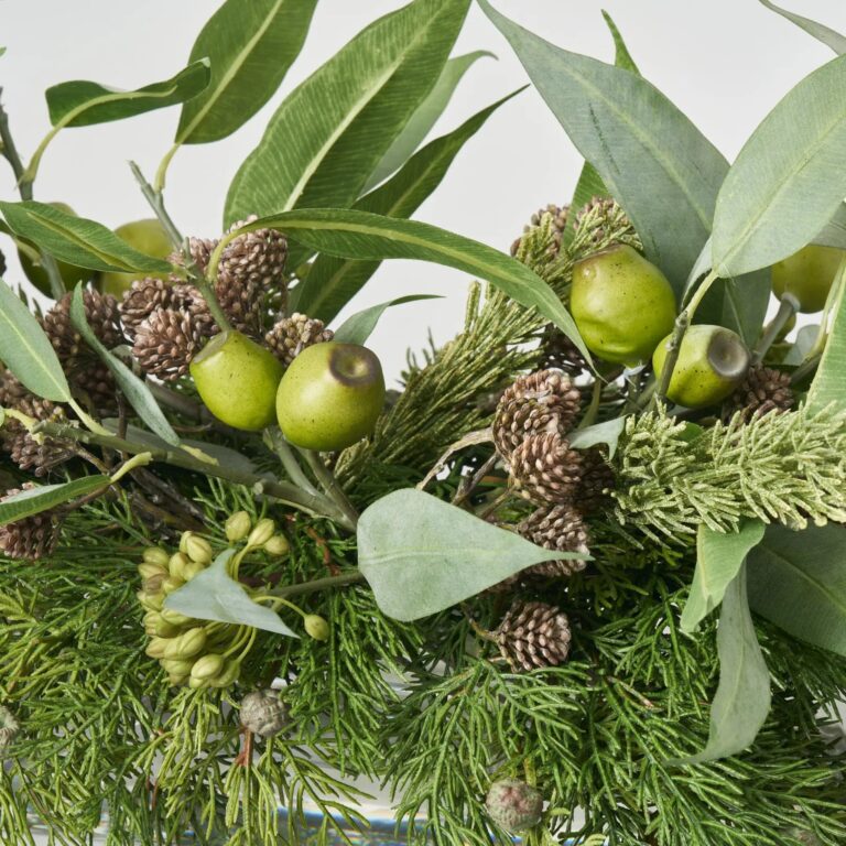 Close-up of vase silhouette detail on this Lifelike Cedar, Seed Pod Eucalyptus Water Illusion Arrangement