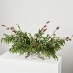 Close-up of vase silhouette detail on this Winter Forrest Melody and Real Water Illusion Arrangement