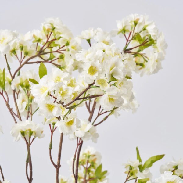 Close-up of vase silhouette detail on this Lifelike White Cherry Blossom Branches Water Illusion Arrangement