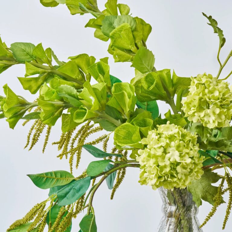 Close-up of vase silhouette detail on this Chlorophyll Cantilever - Bells Large Table Arrangement Water