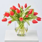 Close-up of vase silhouette detail on this Real Touch Lifelike Red Tulip Water Illusion Arrangement