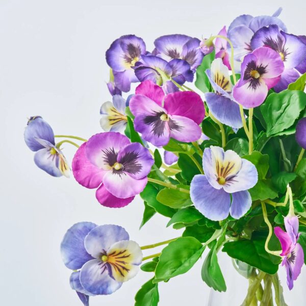 Close-up of vase silhouette detail on this Lifelike Mixed Purple Pansy Blooms Water Illusion Arrangement