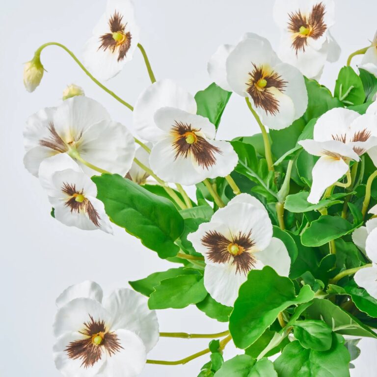 Close-up of vase silhouette detail on this Lifelike White Pansy Blooms Water Illusion Arrangement