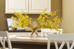 Close-up of vase silhouette detail on this Classic Yellow Forsythia Branches Water Illusion Arrangement