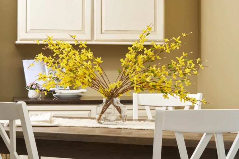 Close-up of vase silhouette detail on this Classic Yellow Forsythia Branches Water Illusion Arrangement
